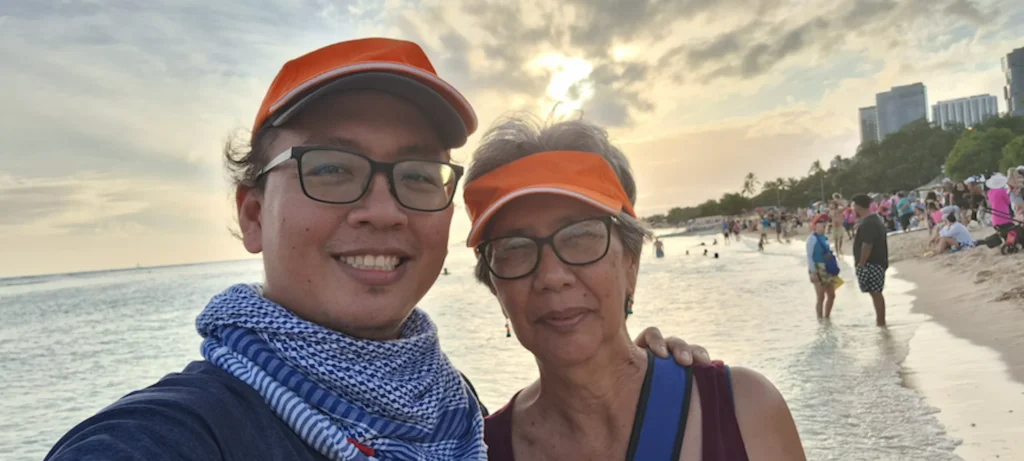 Jacob and Betty Lou Kam on the beach during lantern floating.